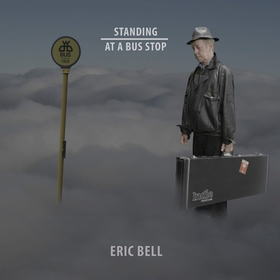 BELL, ERIC - STANDING AT A BUS STOP